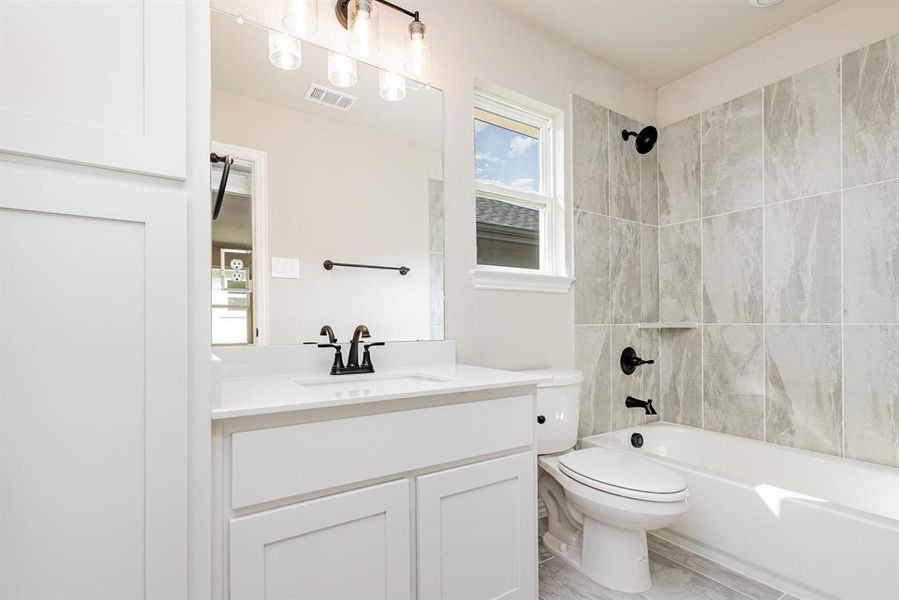 Bathroom with bathtub / shower combination and vanity