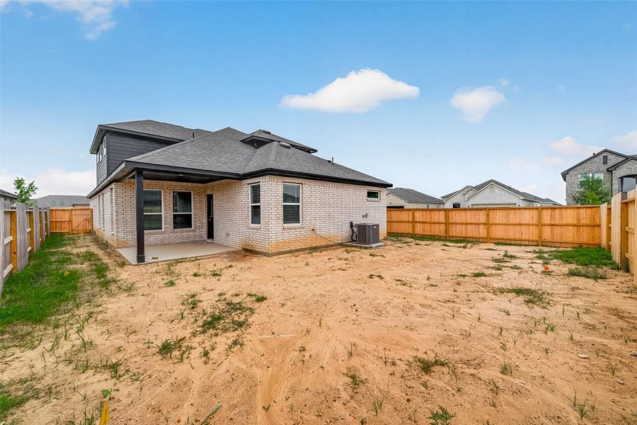 Exterior details and patio area of a home in Sunterra, Katy (Image 24).