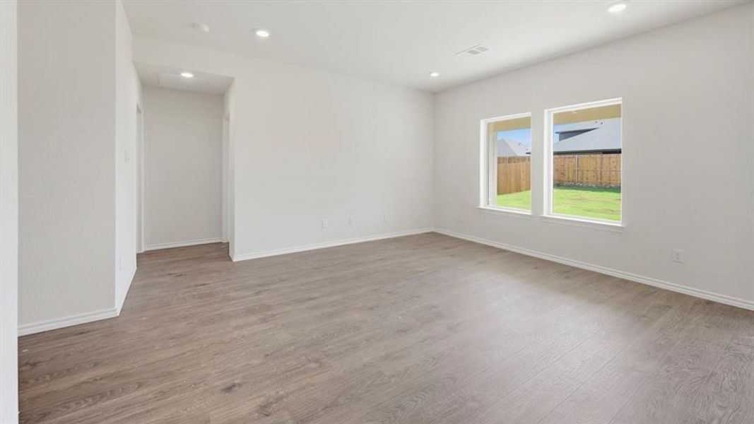 Unfurnished room featuring light wood finished floors and recessed lighting