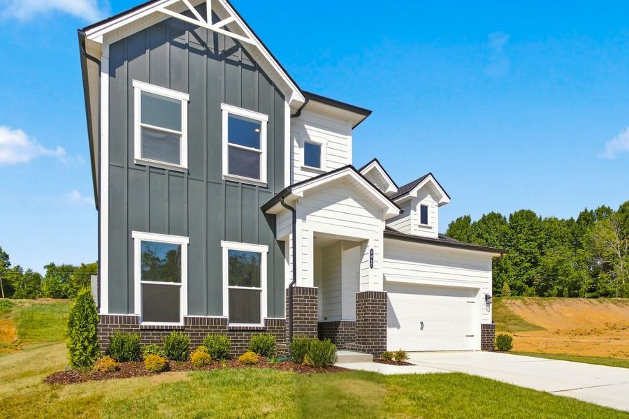 Front exterior of a new home in Hidden Springs - The Village Collection, Smyrna, TN, highlighting curb appeal (Image 2). Front exterior of a new home in Hidden Springs - The Village Collection, Smyrna, TN, highlighting curb appeal (Image 2).