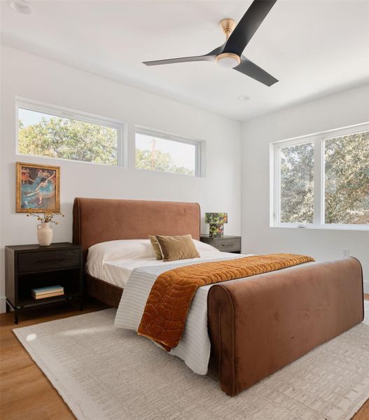 Bedroom with wood finished floors, a ceiling fan, and recessed lighting Bedroom with wood finished floors, a ceiling fan, and recessed lighting