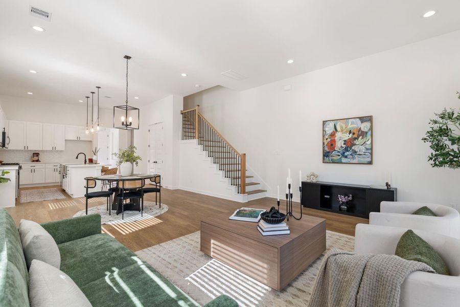 Rare first-floor living room while all three bedrooms thoughtfully located upstairs for privacy.