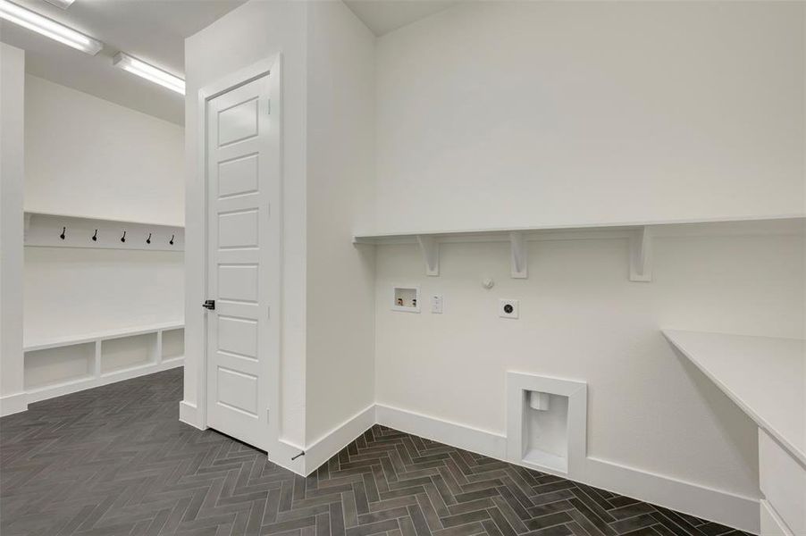 Laundry area featuring hookup for an electric dryer, hookup for a washing machine, and hookup for a gas dryer
