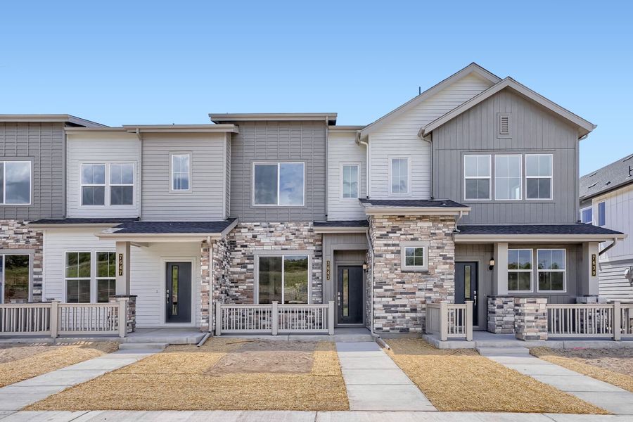 Front exterior of a new home in Vermilion Creek, Centennial, CO, highlighting curb appeal (Image 1). Front exterior of a new home in Vermilion Creek, Centennial, CO, highlighting curb appeal (Image 1).