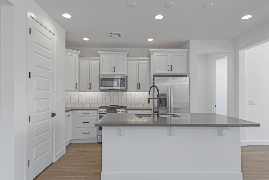 Furnished interior view inside a new home in CantaMia at Estrella 55+, Goodyear (Image 13).