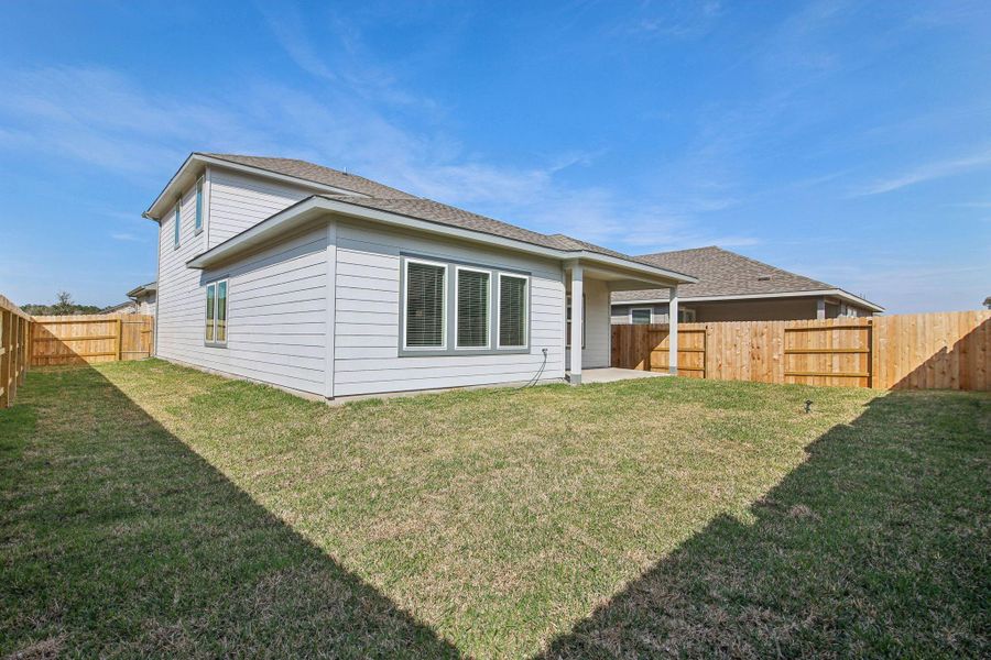 Exterior details and patio area of a home in Landing Meadows - Premier Series, New Caney (Image 4).