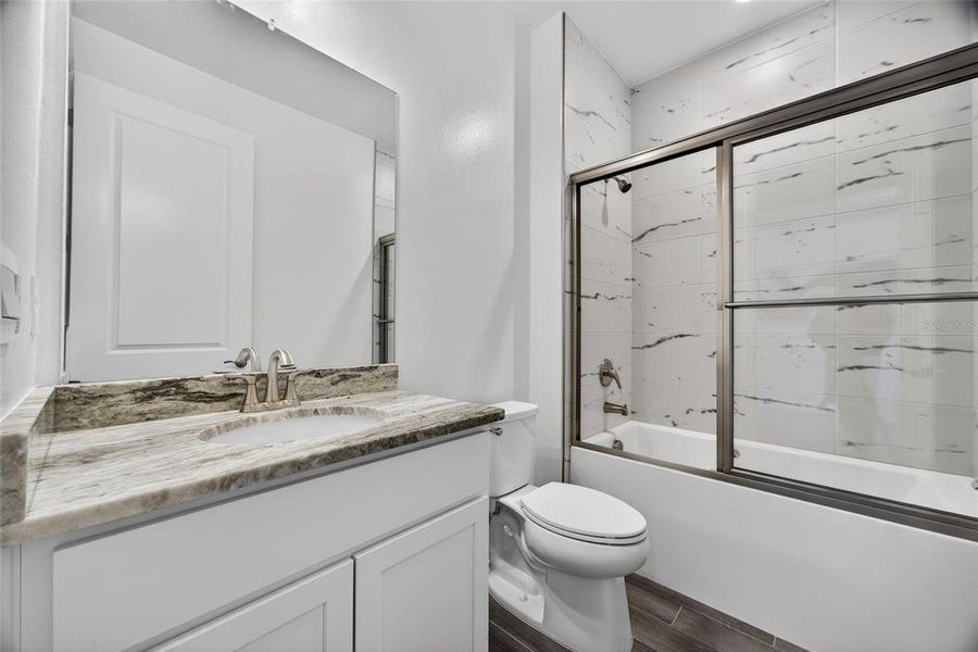 Furnished interior view inside a new home in Heritage Station, Punta Gorda (Image 36).