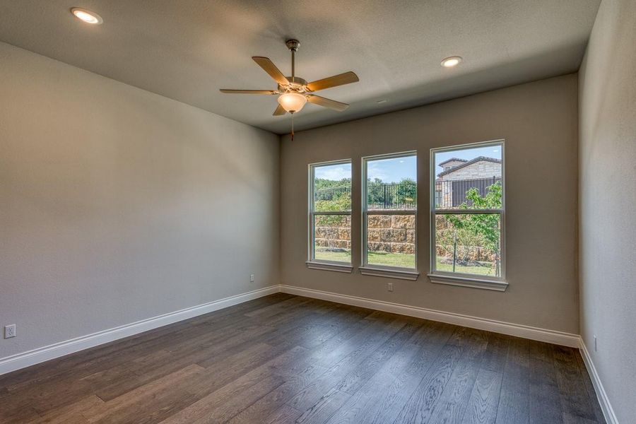 Spare room featuring dark wood finished floors, recessed lighting, and ceiling fan
