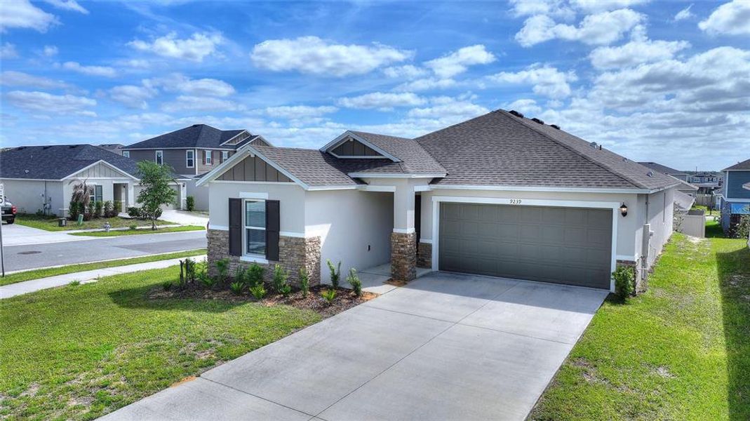 Front exterior of a new home in , Davenport, FL, highlighting curb appeal (Image 17).