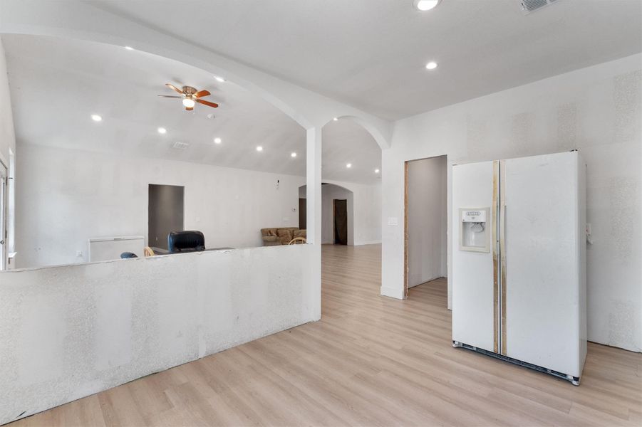 Reception with recessed lighting, arched walkways, and a ceiling fan Reception with recessed lighting, arched walkways, and a ceiling fan