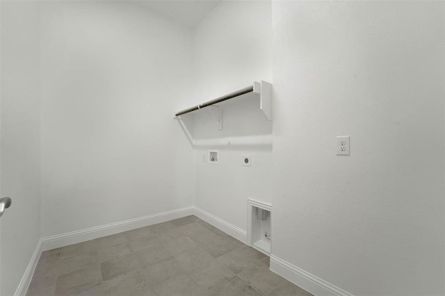 Laundry room featuring washer hookup and electric dryer hookup