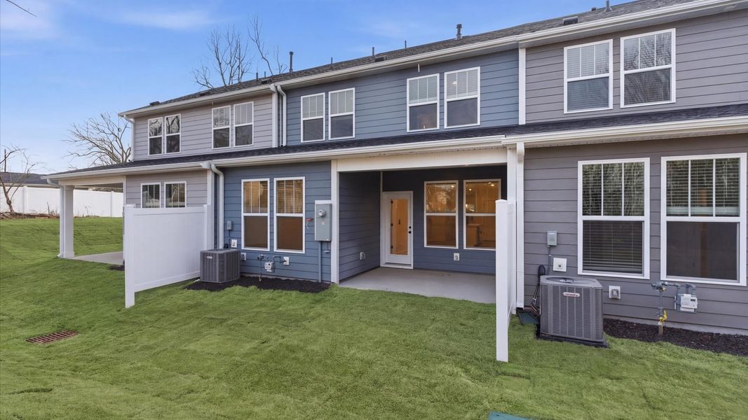 Vibrant rear outdoor space featuring a covered porch and exceptional craftsmanship located in Greenville, SC