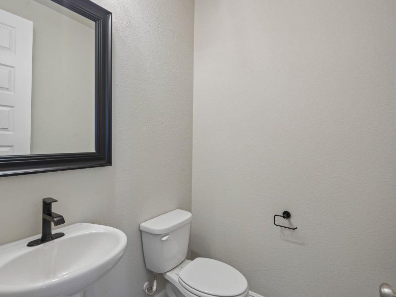 Furnished interior view inside a new home in Massey Oaks - Estate Series, Pearland (Image 30).