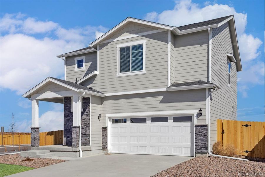 Front exterior of a new home in , Commerce City, CO, highlighting curb appeal (Image 1).