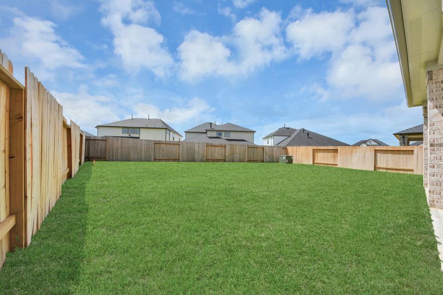 Backyard retreat, offering an abundance of space for kids to play and explore. The possibilities are endless in this outdoor haven, where the joy of open-air activities and family gatherings awaits.
