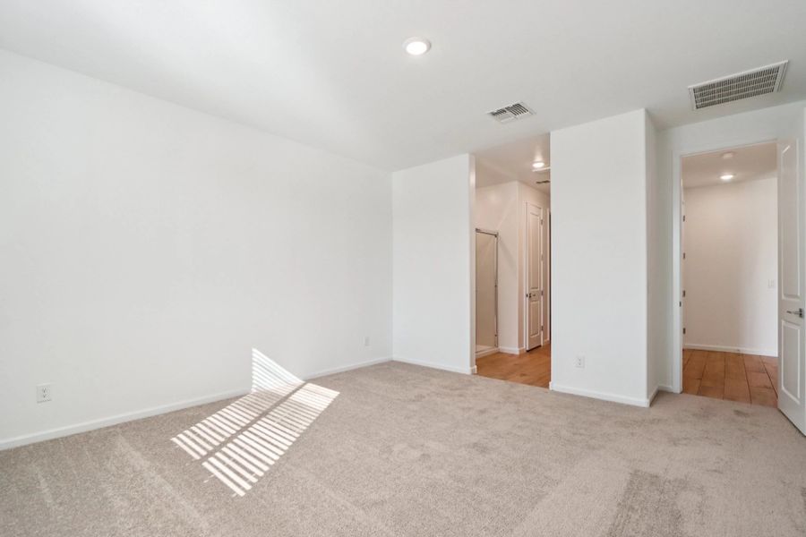 Primary suite. Representative images and renderings are for illustrative purposes. Actual structural options and design finishes of home may vary.
