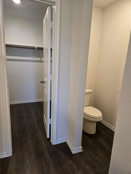 Bathroom with toilet and hardwood / wood-style floors