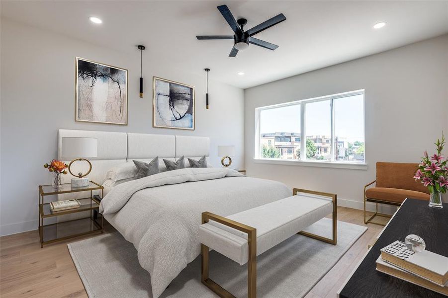 Bedroom with ceiling fan and light hardwood / wood-style flooring