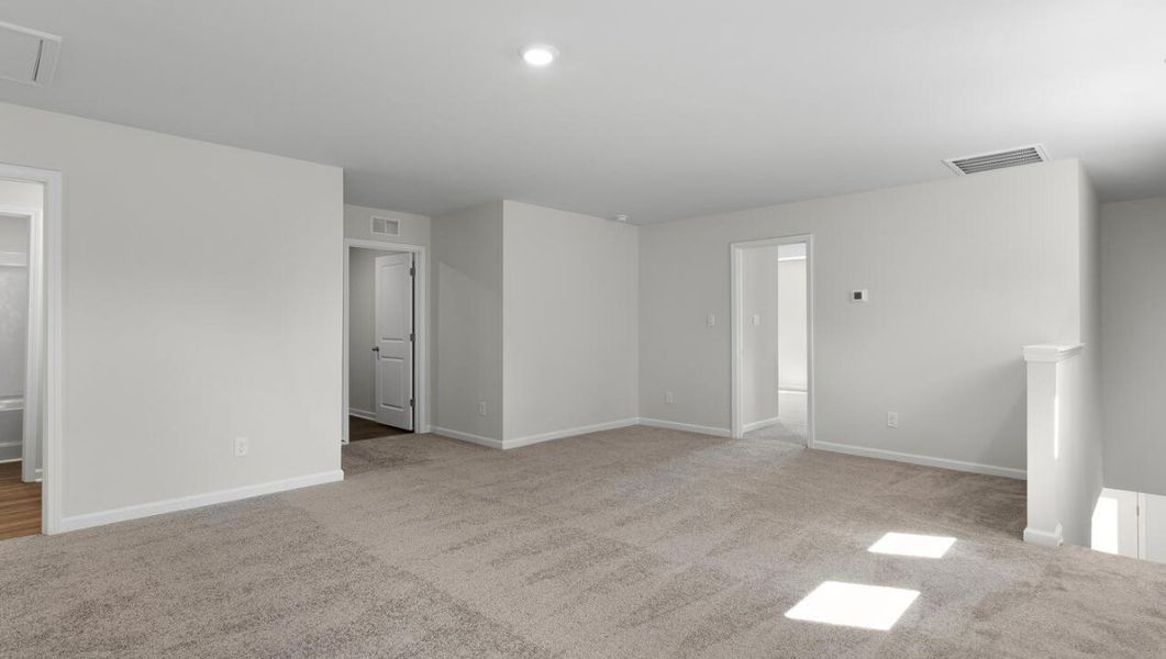 Representative unfurnished interior of a home built from the WOODSTOCK by D.R. Horton in Surfside Landing, Hubert (Image 27).