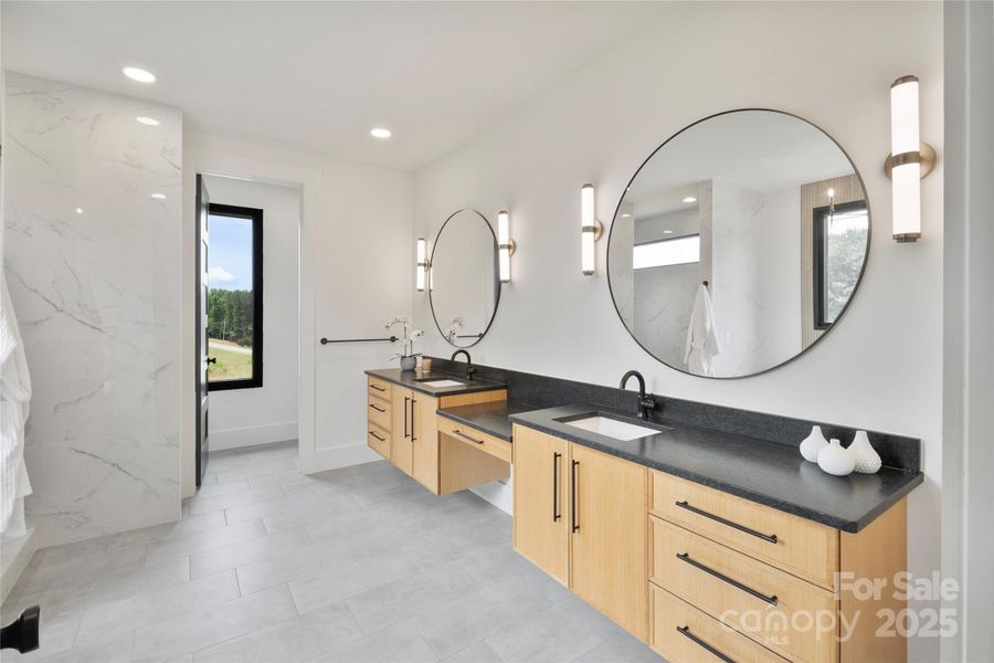 Primary Bath - dual vanities w/leathered graite counters Primary Bath - dual vanities w/leathered graite counters