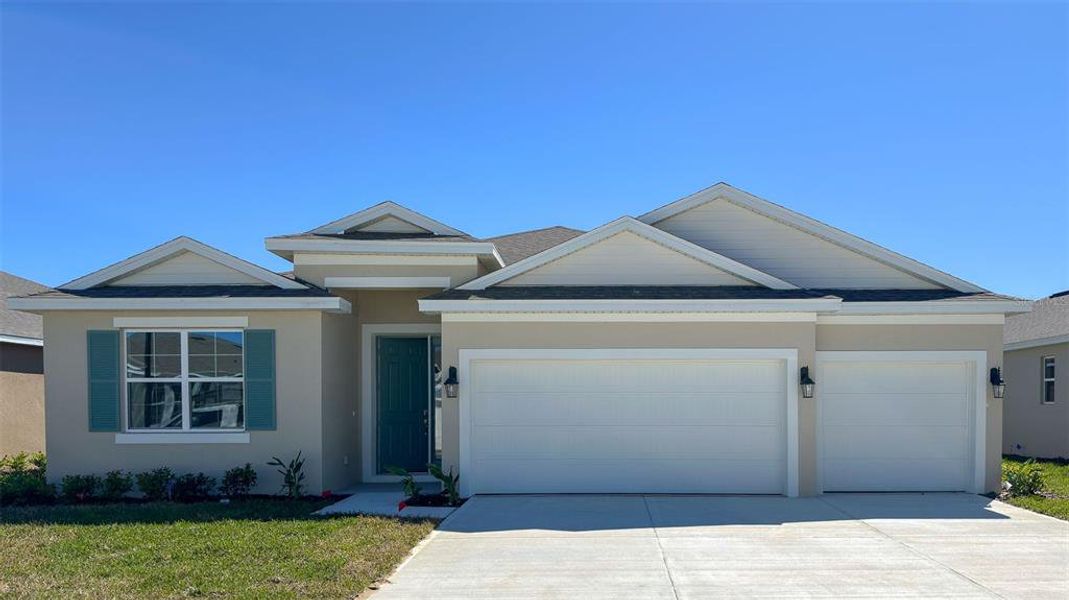 Front exterior of a new home in Wynwood, Ocoee, FL, highlighting curb appeal (Image 1). Front exterior of a new home in Wynwood, Ocoee, FL, highlighting curb appeal (Image 1).