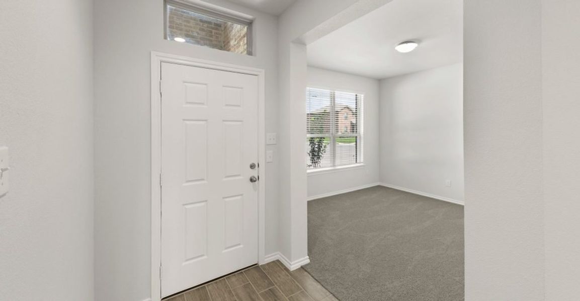 Representative exterior photo of a completed home built from the Raleigh by Impression Homes in Baker Farms, Cleburne, TX (Image 3).