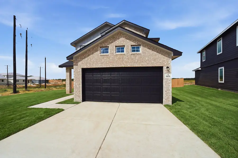 Front exterior of a new home in Garden Grove, San Antonio, TX, highlighting curb appeal (Image 17).