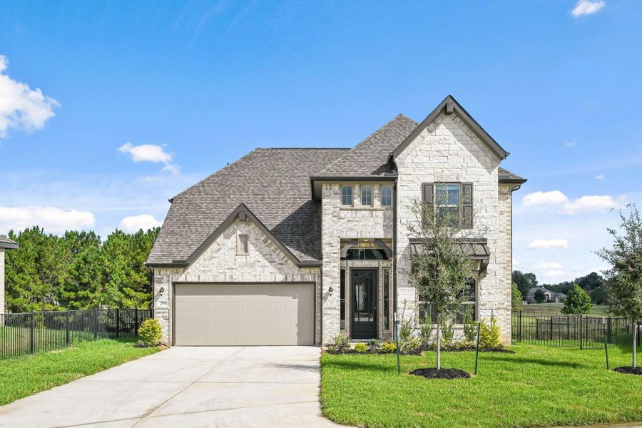 Front exterior of a new home in Waterstone on Lake Conroe, Montgomery, TX, highlighting curb appeal (Image 1). Front exterior of a new home in Waterstone on Lake Conroe, Montgomery, TX, highlighting curb appeal (Image 1).