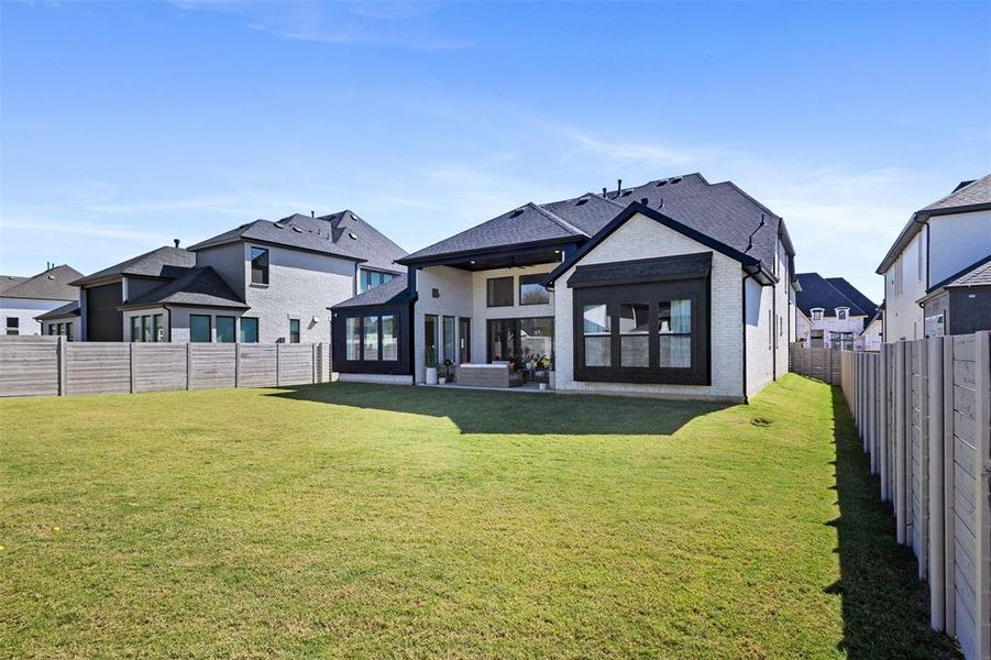 Back of house with a patio area, a ceiling fan, a fenced backyard, and brick siding Back of house with a patio area, a ceiling fan, a fenced backyard, and brick siding