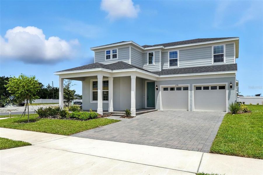 Front exterior of a new home in Winter Grove, Winter Garden, FL, highlighting curb appeal (Image 19).