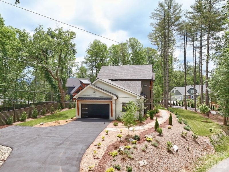 Front exterior of a new home in , Brevard, NC, highlighting curb appeal (Image 25).
