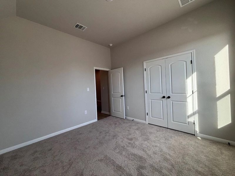 Spacious, unfurnished interior of a new home in The Colony, Bastrop (Image 13).