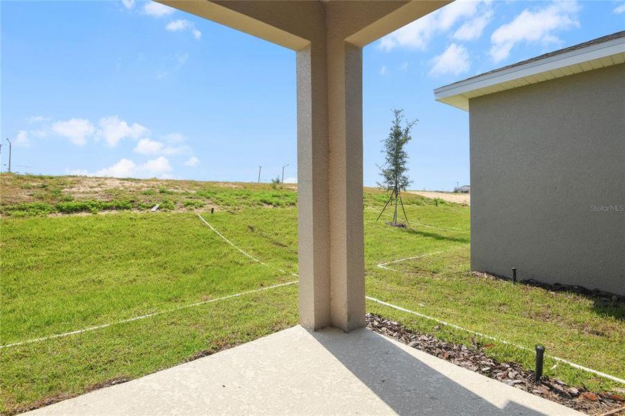 Front exterior of a new home in Seasons at Scenic Terrace, Lake Hamilton, FL, highlighting curb appeal (Image 2).