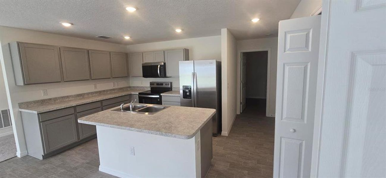Furnished interior view inside a new home in , Poinciana (Image 7). Furnished interior view inside a new home in , Poinciana (Image 7).
