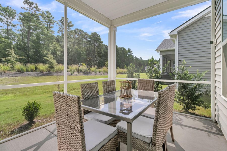 Exterior details and patio area of a home in Summerwind Crossing at Lakes of Cane Bay, Summerville (Image 28).
