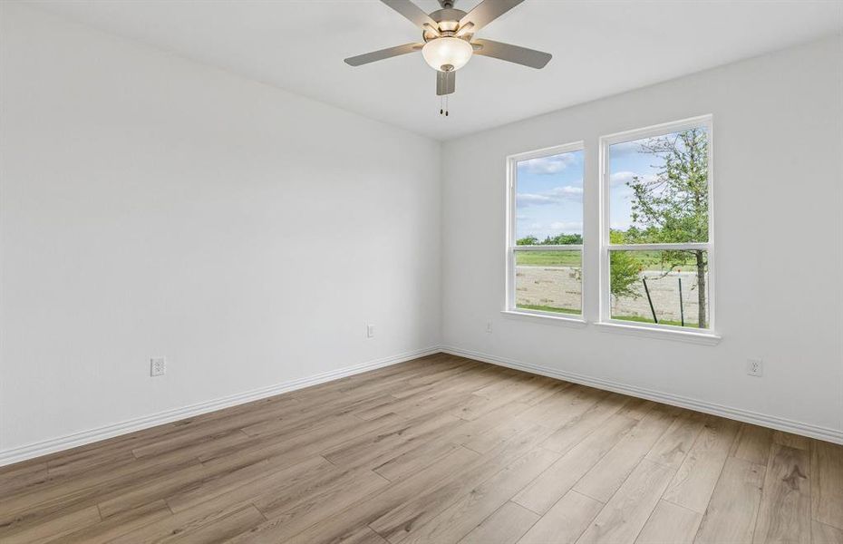 Primary suite with large window Primary suite with large window