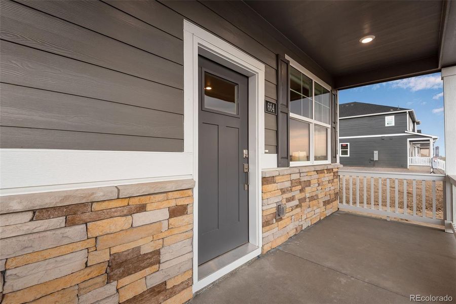 Front exterior of a new home in Vista Meadows, Fort Lupton, CO, highlighting curb appeal (Image 2).
