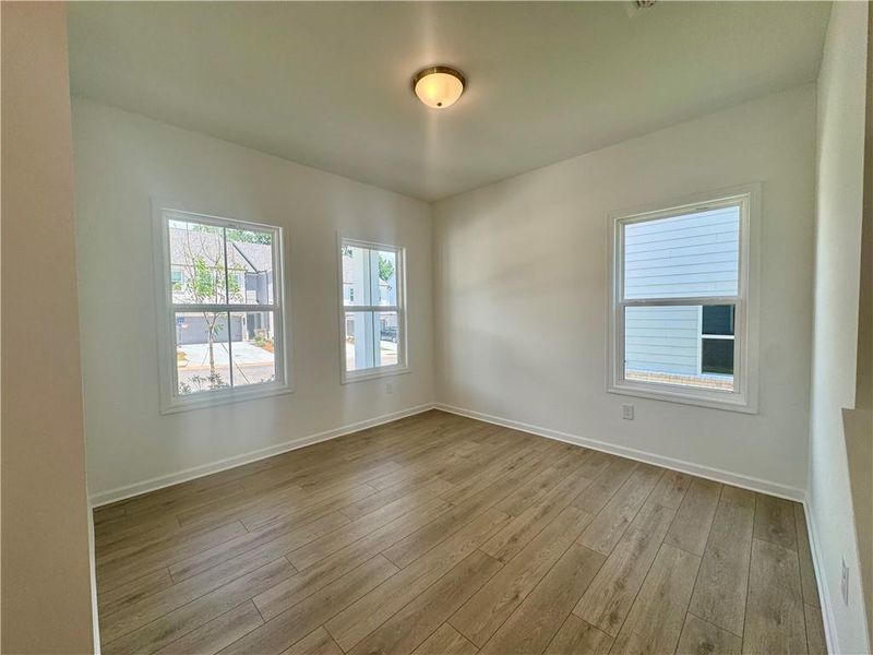 Spacious, unfurnished interior of a new home in Eastlyn Crossing, Flowery Branch (Image 22).