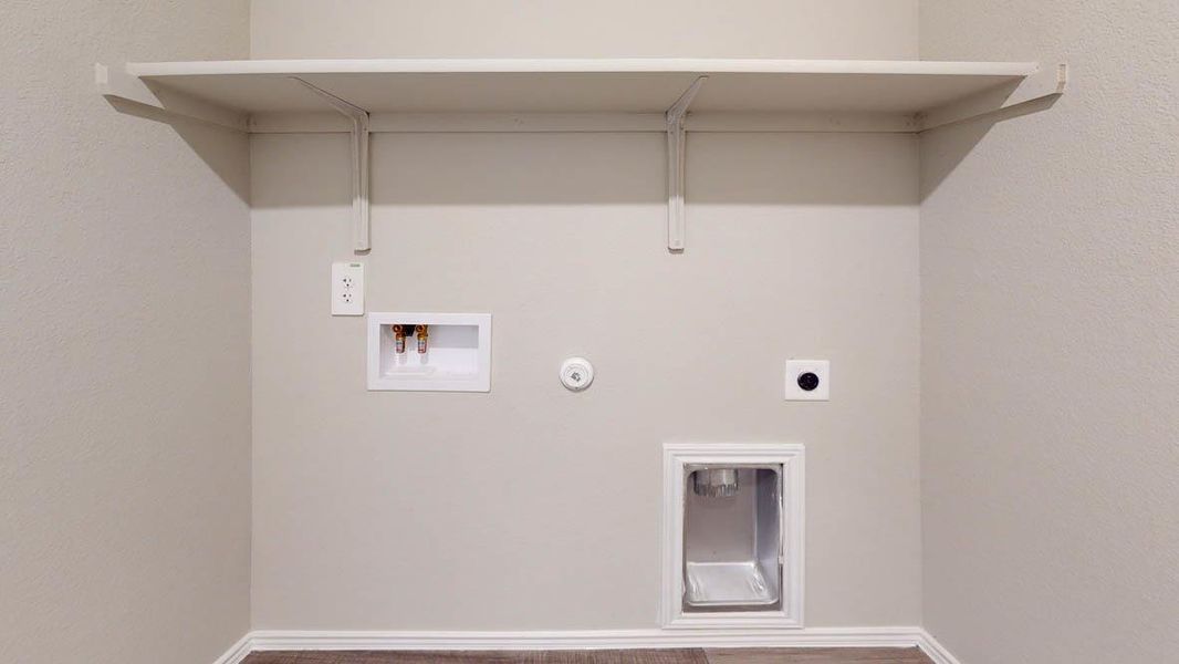 Laundry room with hookup for a gas dryer, washer hookup, a textured wall, and hookup for an electric dryer