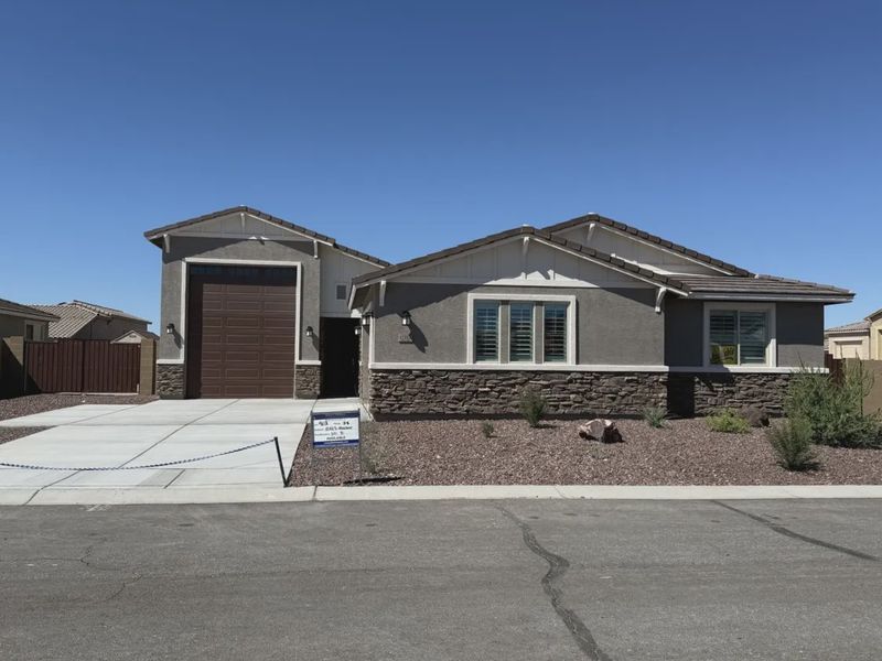Front exterior of a new home in Las Barrancas, Yuma, AZ, highlighting curb appeal (Image 9). Front exterior of a new home in Las Barrancas, Yuma, AZ, highlighting curb appeal (Image 9).