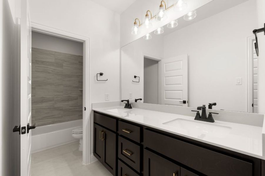 Representative furnished interior of a home built from the The Whitney by UnionMain Homes in Cambridge Crossing, Celina (Image 17).