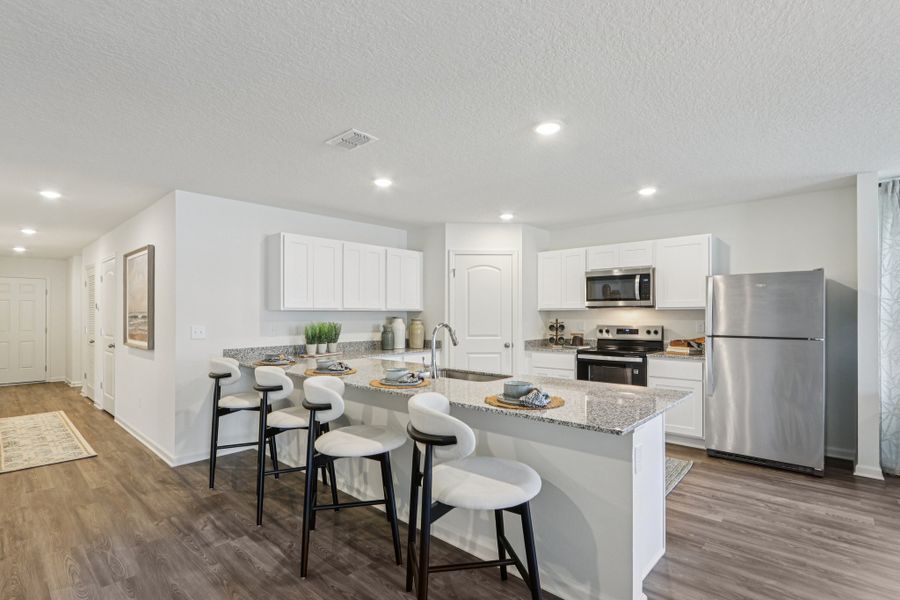 A kitchen with white cabinets. A kitchen with white cabinets.
