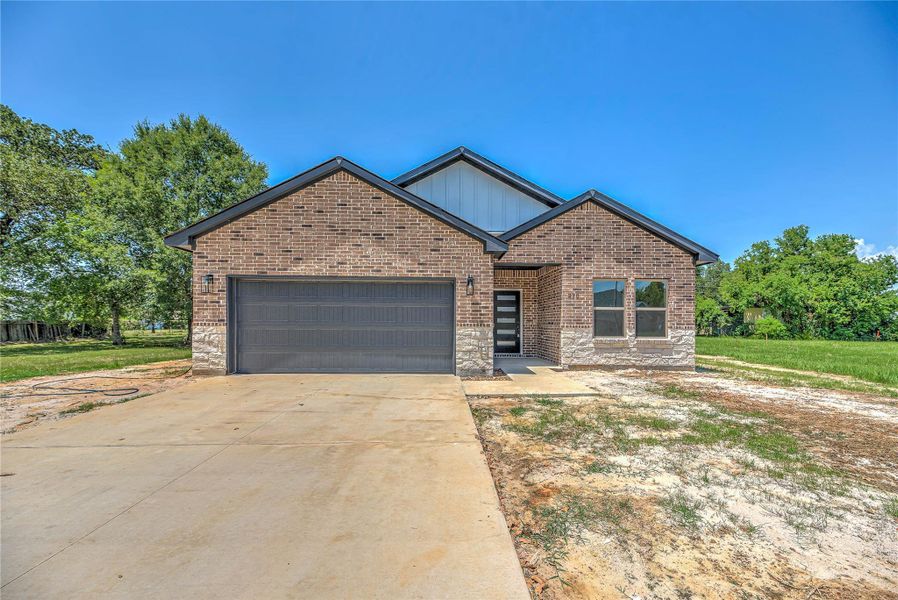 Front exterior of a new home in , Livingston, TX, highlighting curb appeal (Image 16). Front exterior of a new home in , Livingston, TX, highlighting curb appeal (Image 16).