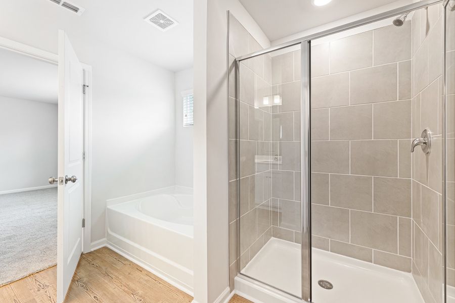 A bathroom with a glass shower. A bathroom with a glass shower.