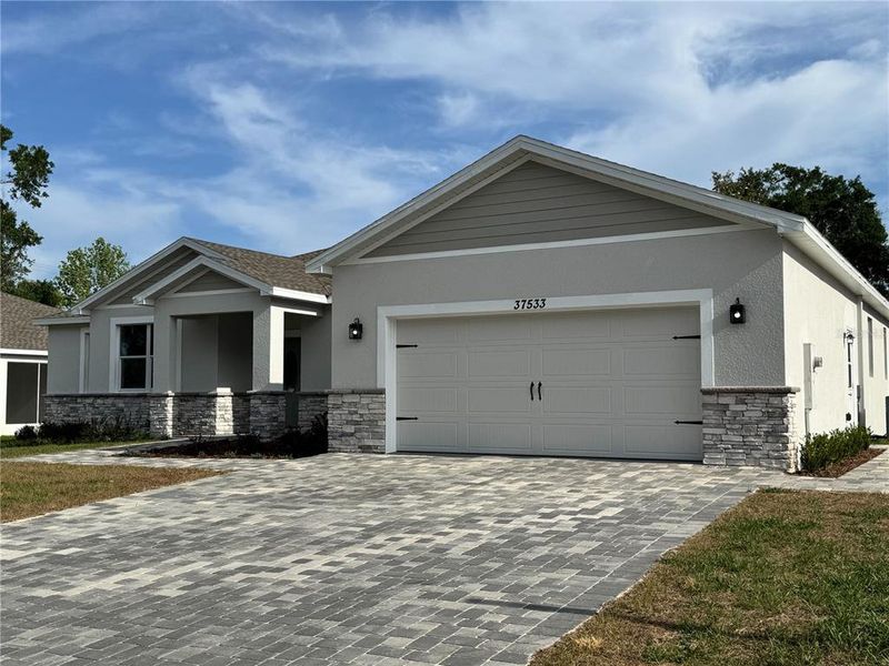 Front exterior of a new home in , Dade City, FL, highlighting curb appeal (Image 24). Front exterior of a new home in , Dade City, FL, highlighting curb appeal (Image 24).