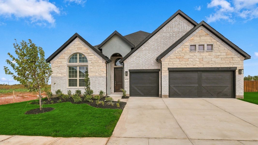 Front exterior of a new home in Green Meadows Classic, Celina, TX, highlighting curb appeal (Image 22).