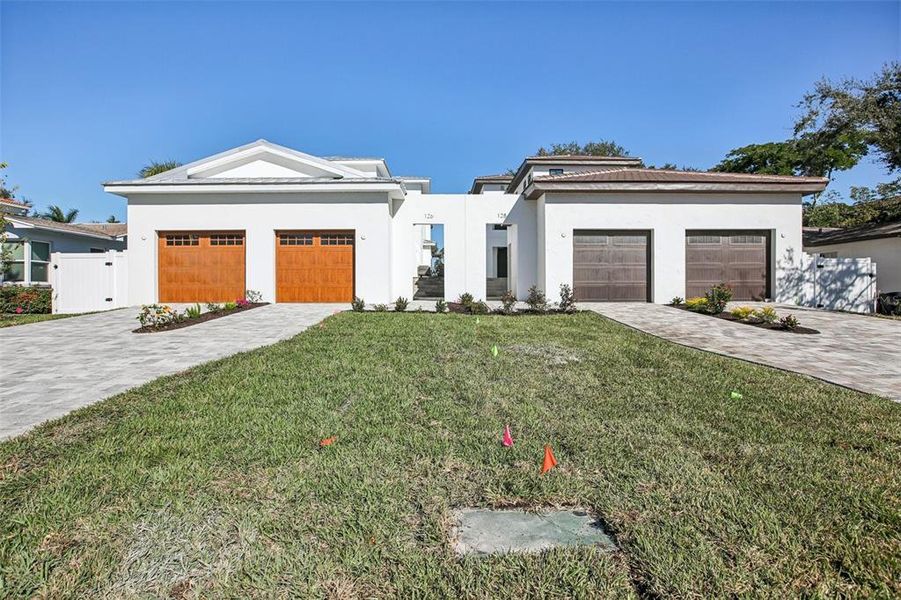 Front exterior of a new home in , St. Petersburg, FL, highlighting curb appeal (Image 26). Front exterior of a new home in , St. Petersburg, FL, highlighting curb appeal (Image 26).