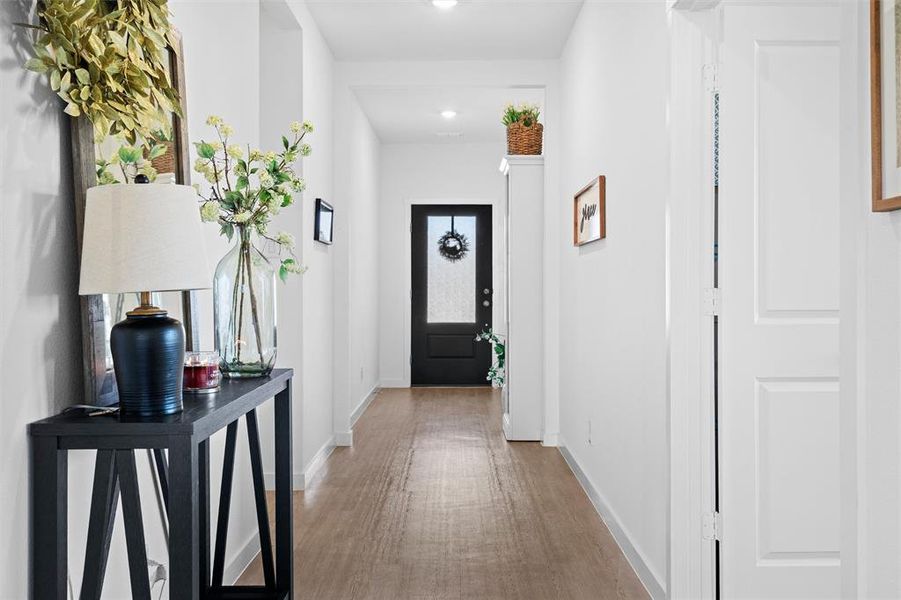 Doorway featuring wood LVP floors and recessed lighting Doorway featuring wood LVP floors and recessed lighting
