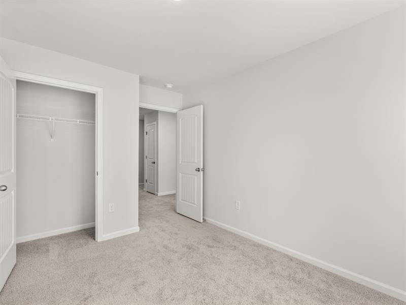 Spacious, unfurnished interior of a new home in Waypoint, Flowery Branch (Image 17).