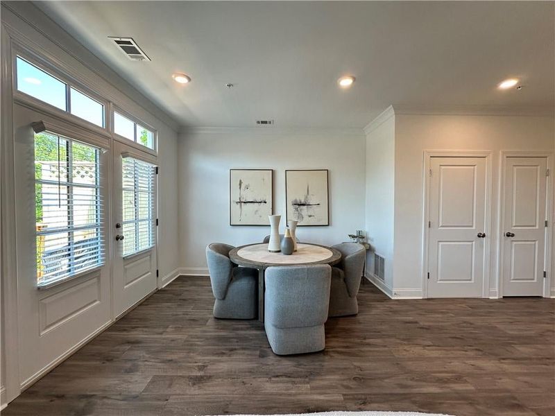 Dining space featuring  french doors leading to outdoor patio, ornamental molding, and baseboards *photos are from the Magnolia model at different home site*